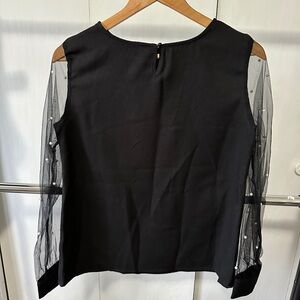 Black long sleeve with sheer pearl sleeves.
